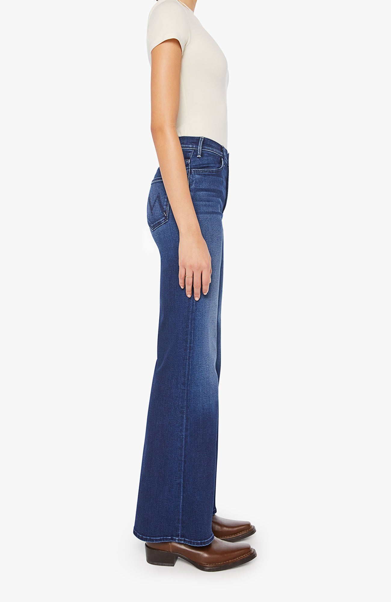 Person wearing blue jeans on a white background