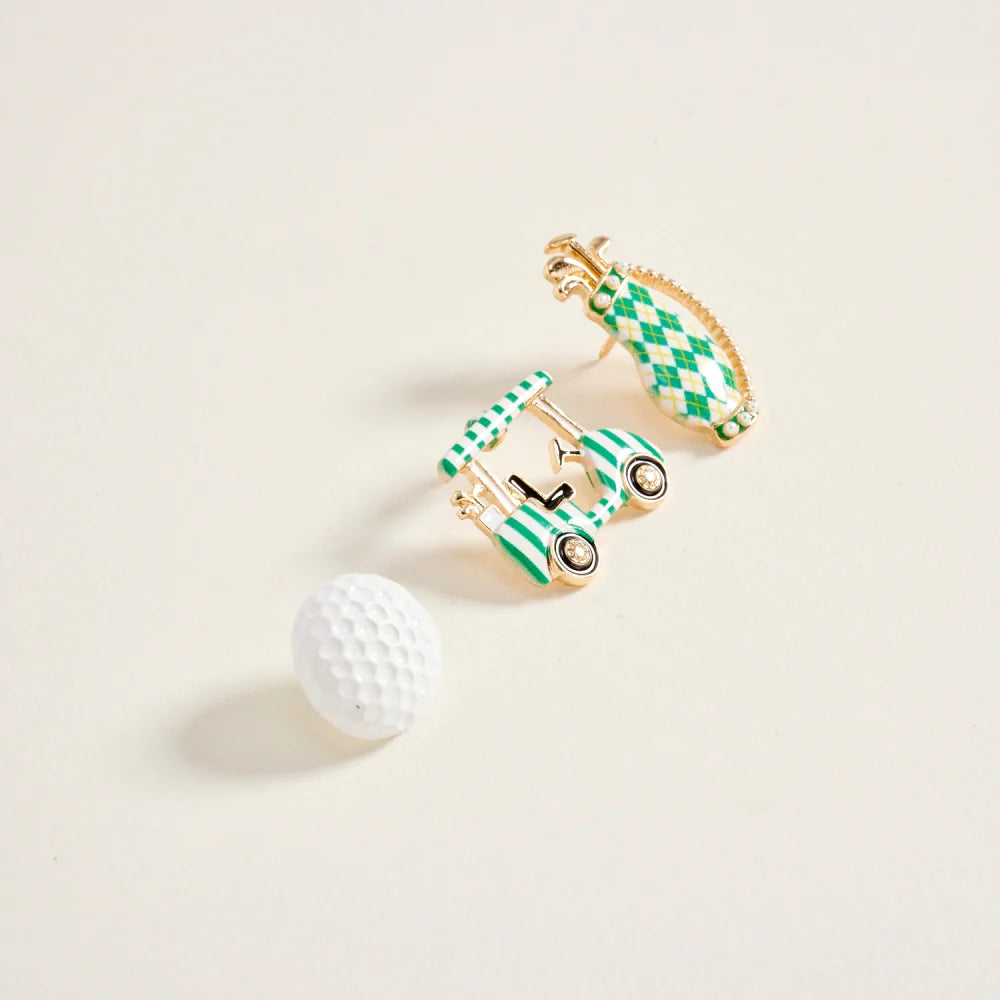 Pair of green and gold checkered earrings on a beige background