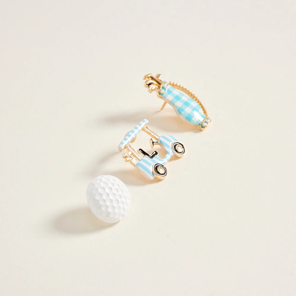 Golf-themed cufflinks with a golf ball on a light beige background