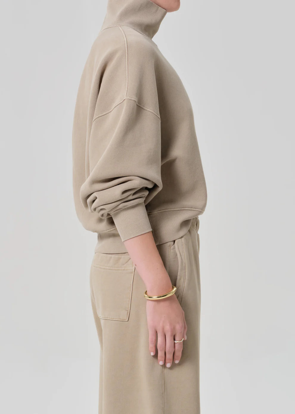 a tan sweatshirt worn on a woman side view
