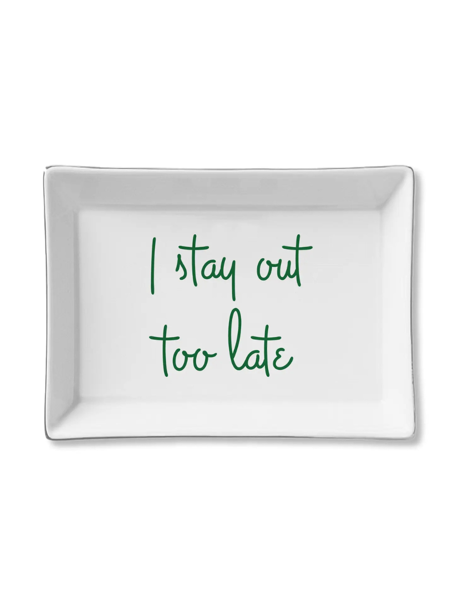 White rectangular tray with green text 'I stay out too late' on a white background