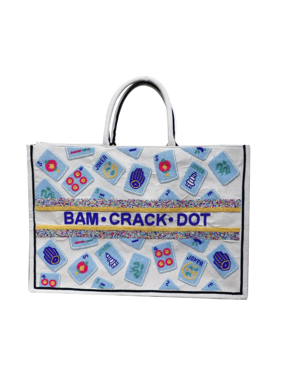 Tote bag with colorful pattern and 'Bam Crack Dot' text on a white background