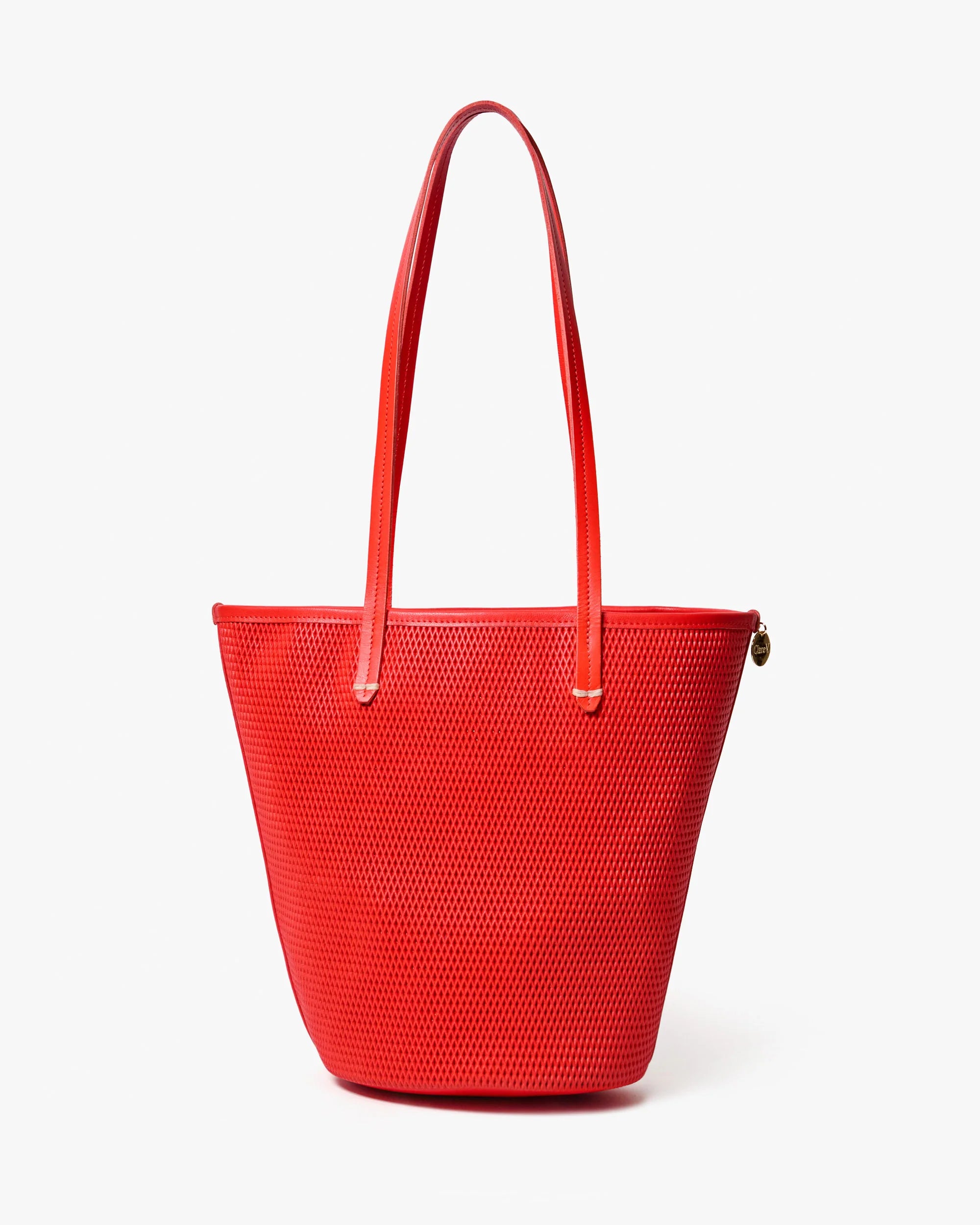 Red textured handbag on a white background