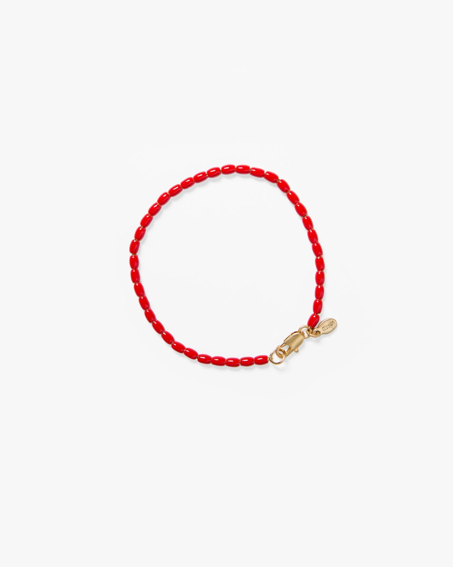 Red beaded bracelet with a gold clasp on a white background