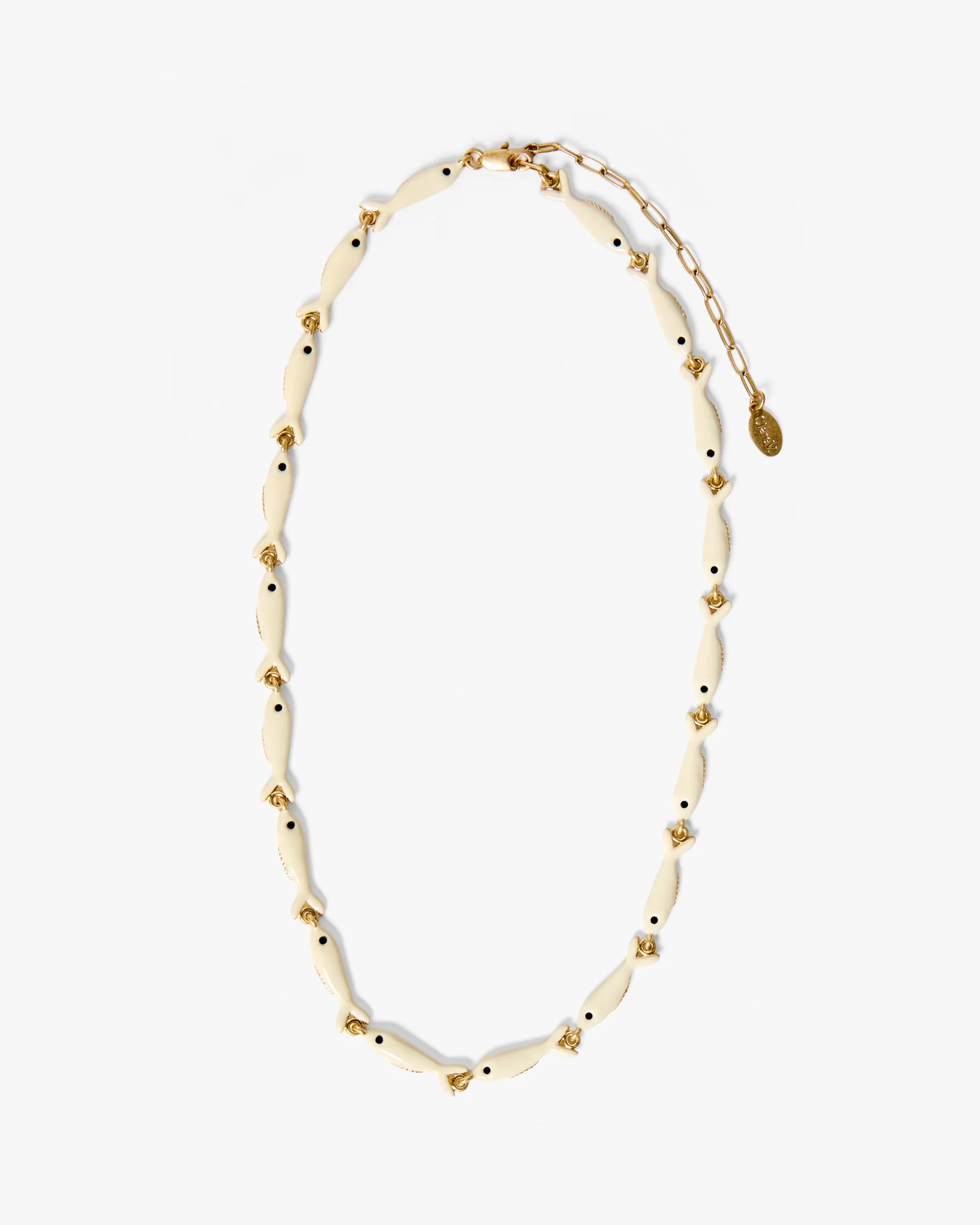 Necklace with white beads and gold accents on a white background
