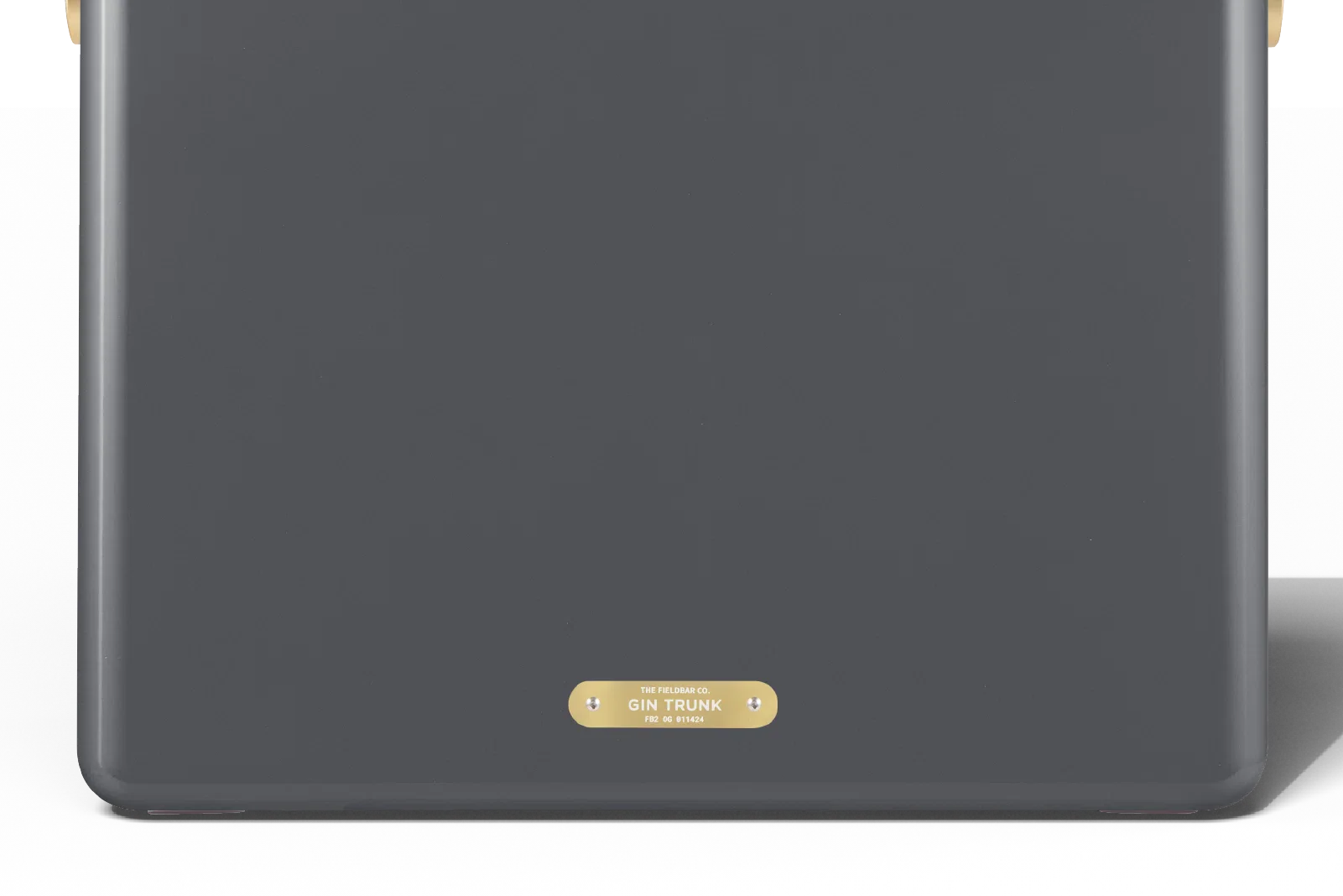 Dark gray electronic device with a gold label on a white background