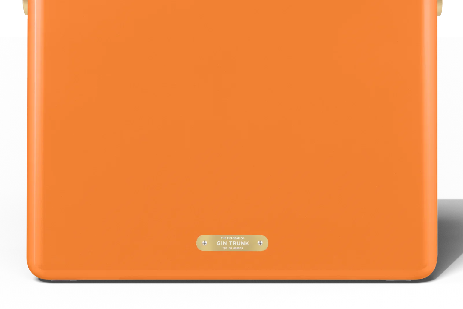 Orange suitcase with a gold label on a white background