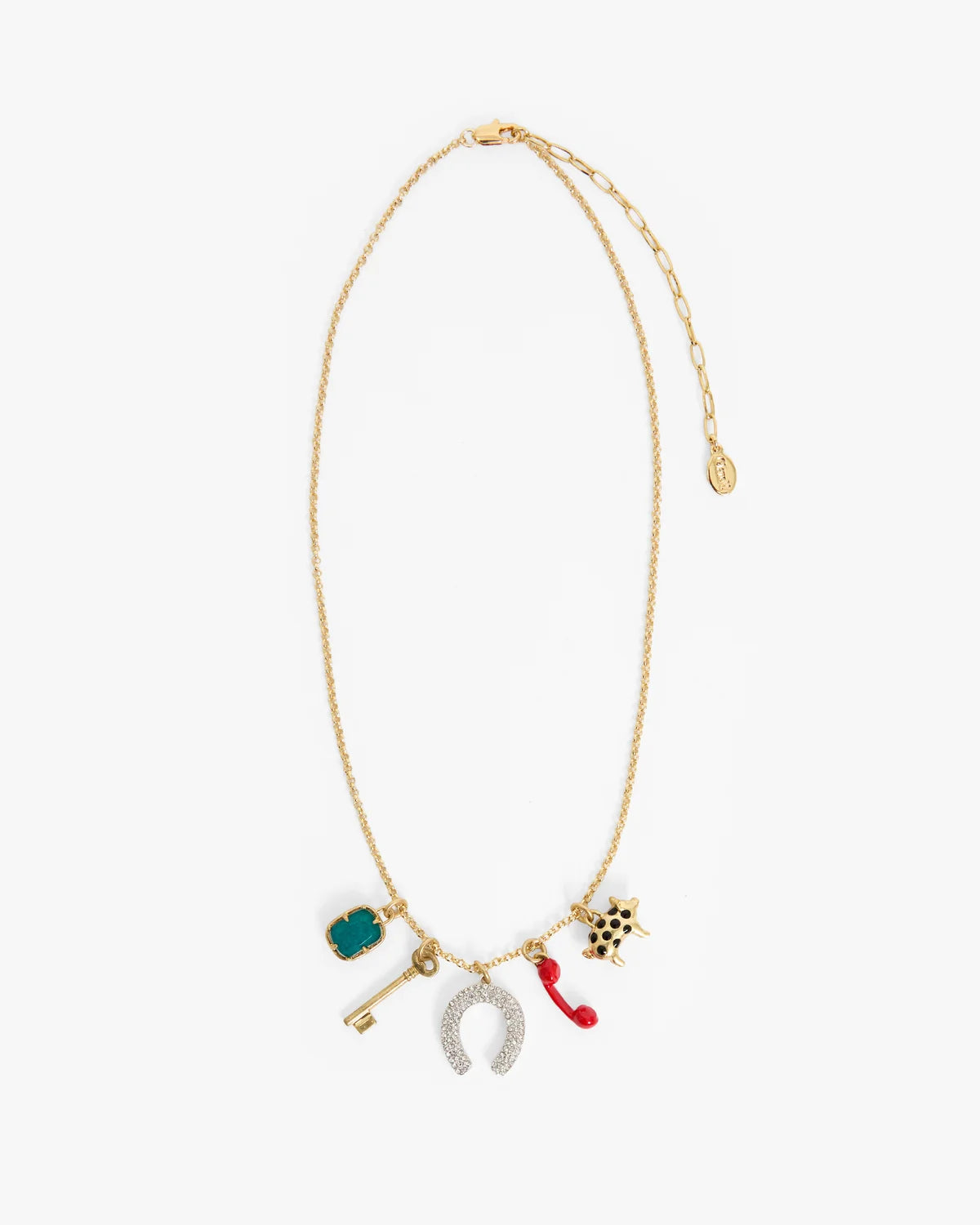 A gold chain necklace with multiple small charms, including a turquoise key, a silver horseshoe, a red raindrop, and a gold keychain, displayed on a clean white background.
