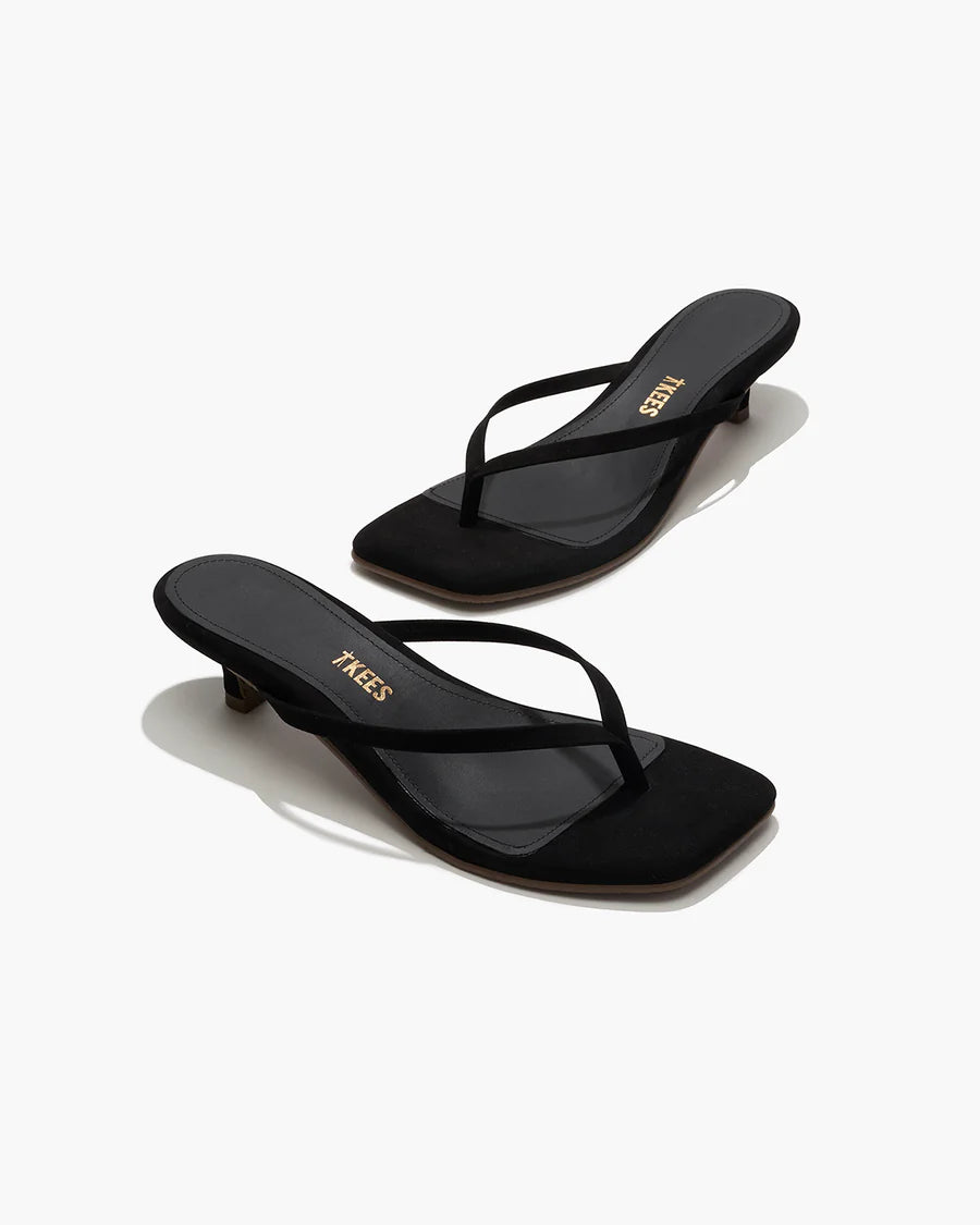 Black sandals with a brand logo on a white background