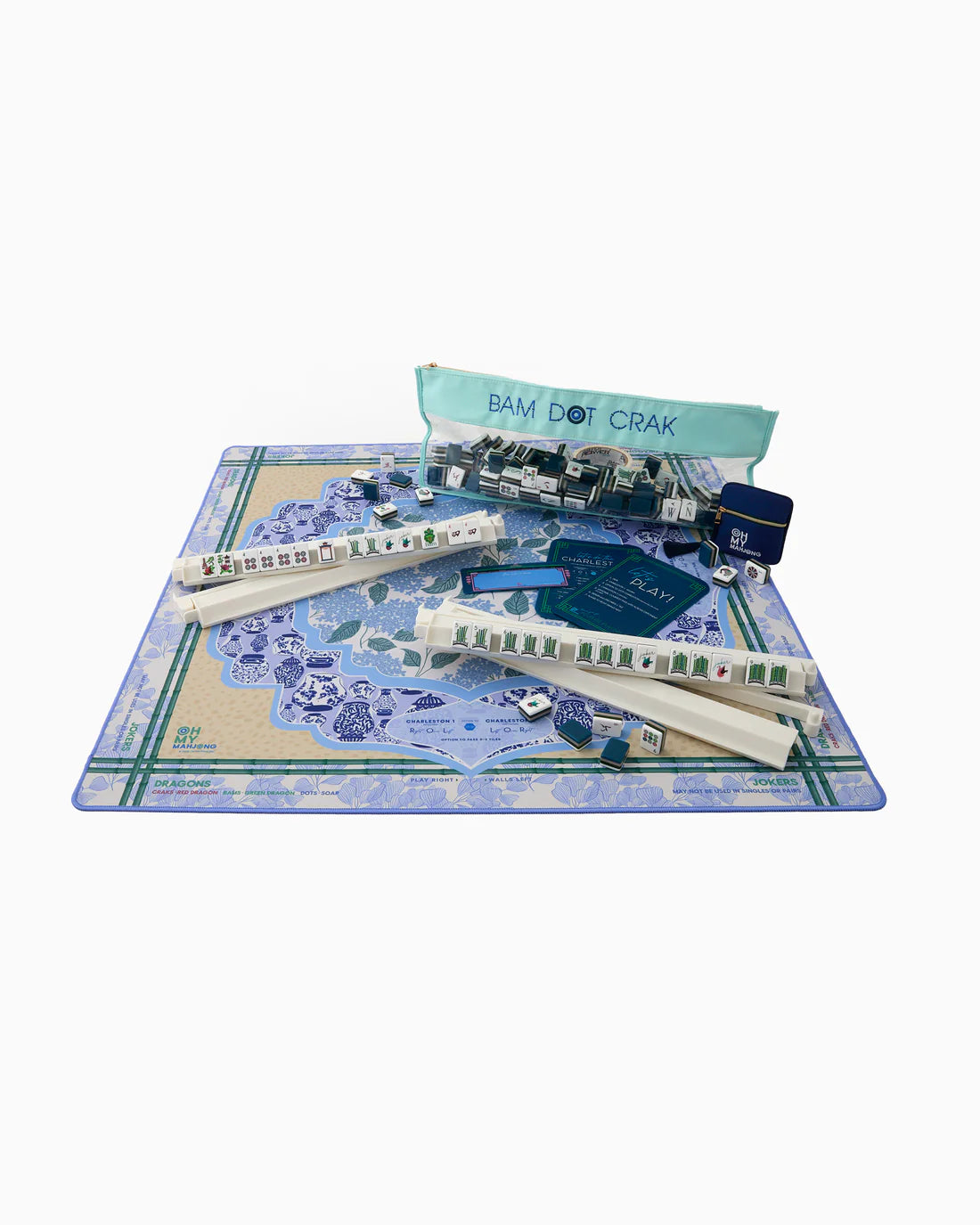 Model train set with tracks and accessories on a play mat with 'Bam Dot Crak' branding.