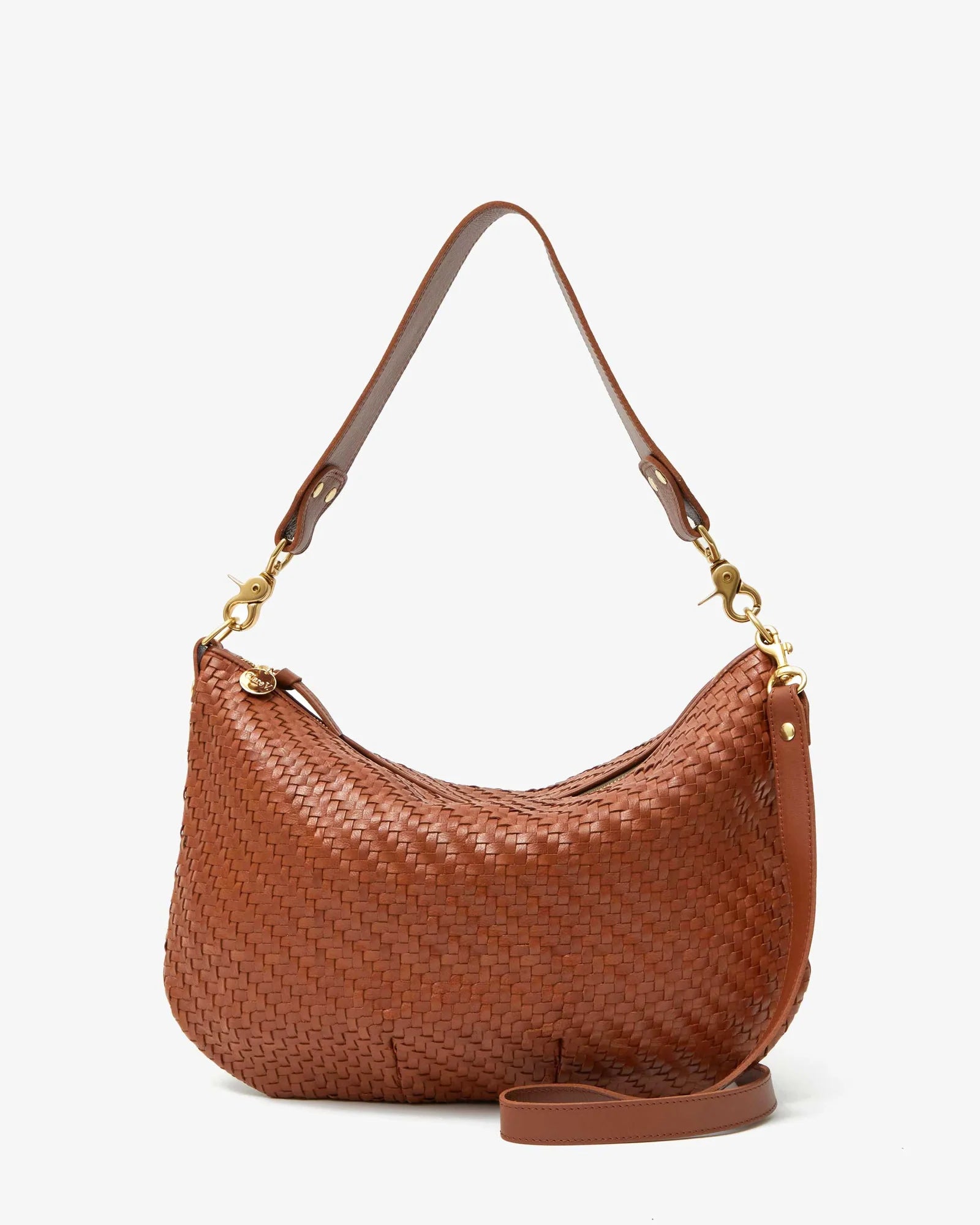 Brown woven handbag with gold accents on a white background