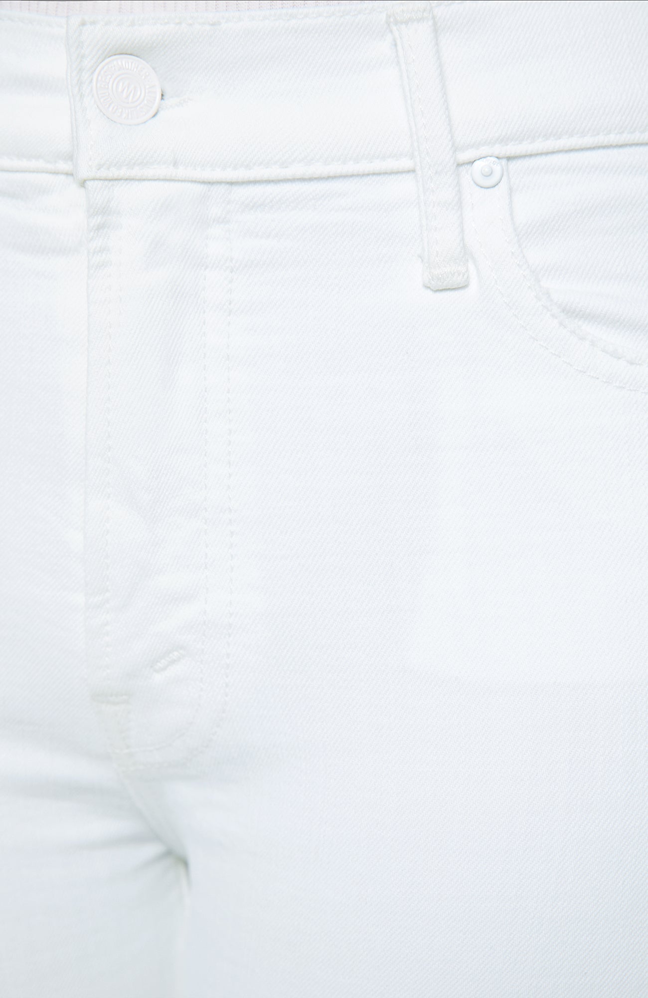Close-up of white denim fabric with stitching details