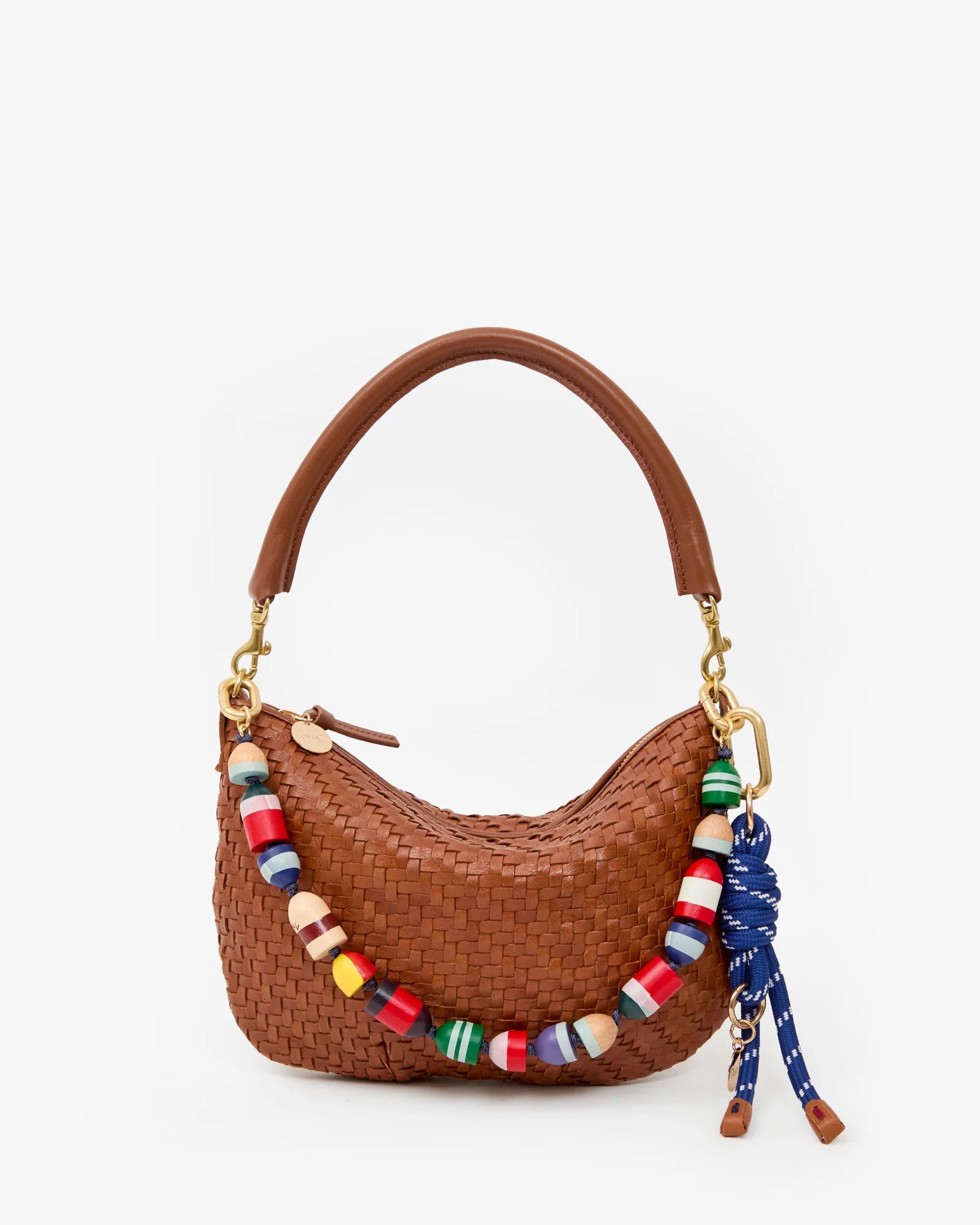 Brown woven handbag with colorful beaded strap on a white background
