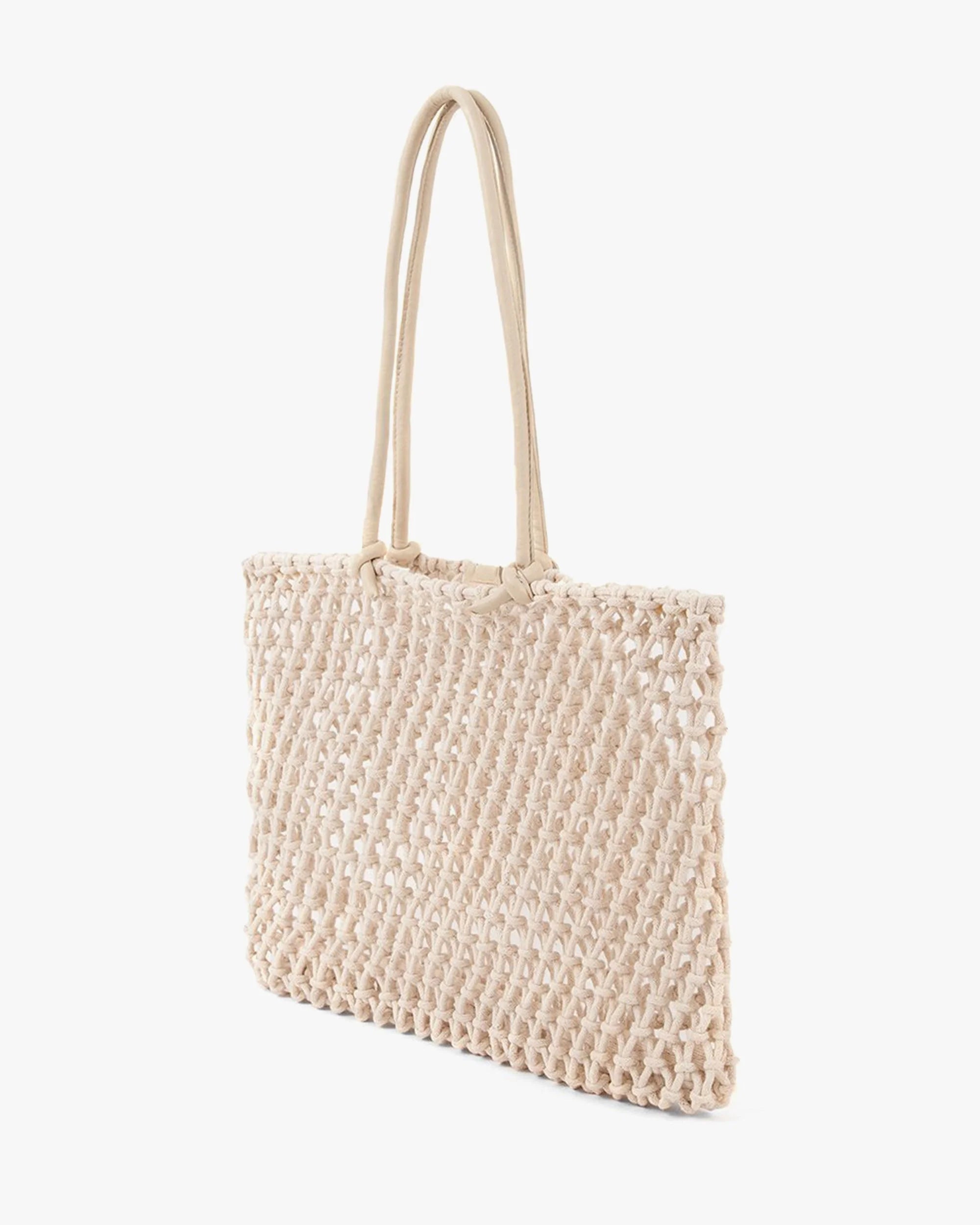 Woven beige handbag on a white background