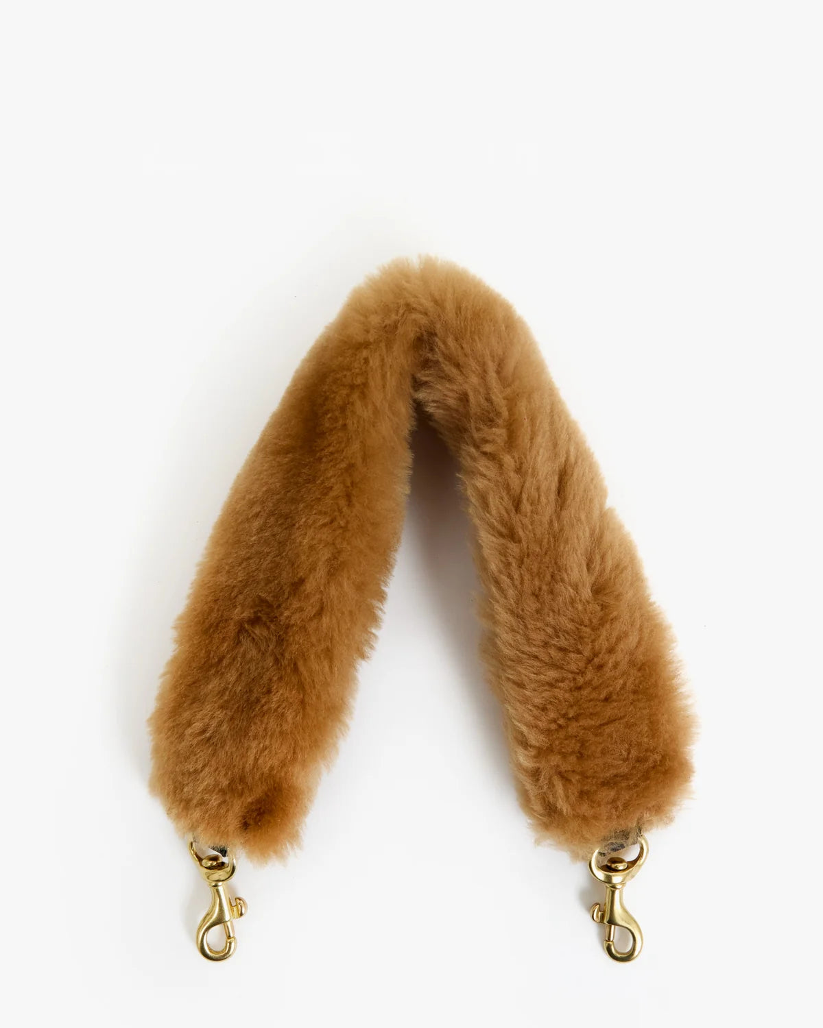 A camel brown faux fur shoulder strap with gold-tone metal swivel clasp hardware, shown against a plain white background.