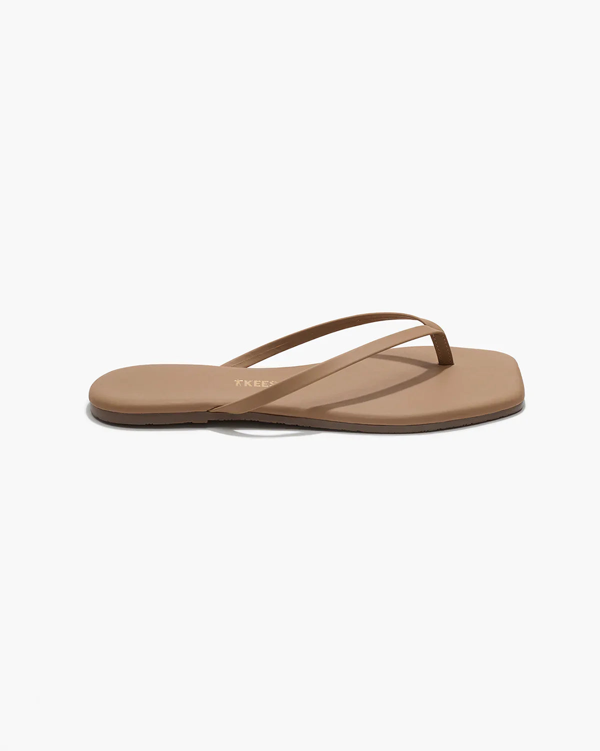 Brown sandal with 'TKEES' branding on a white background