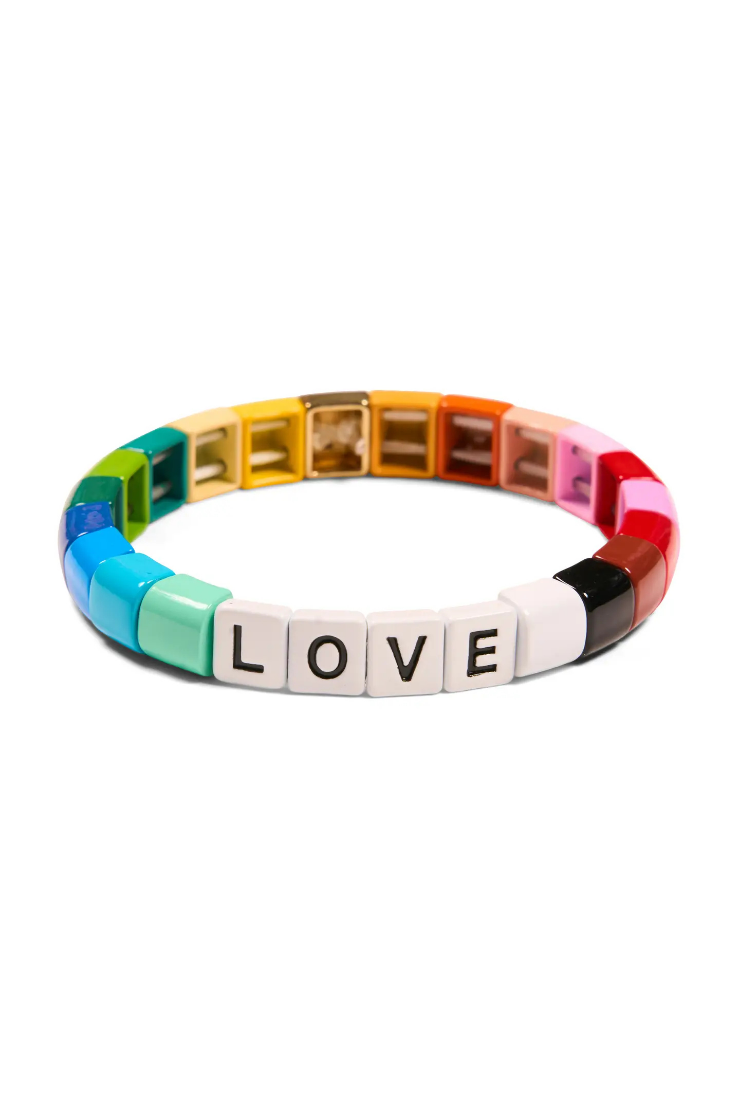 A circular beaded bracelet made of colorful square beads, with the letters LOVE spelled out in white square beads on the front. The bracelet features a rainbow gradient of colors including green, blue, teal, yellow, orange, pink, red, and white, set against a plain white background.