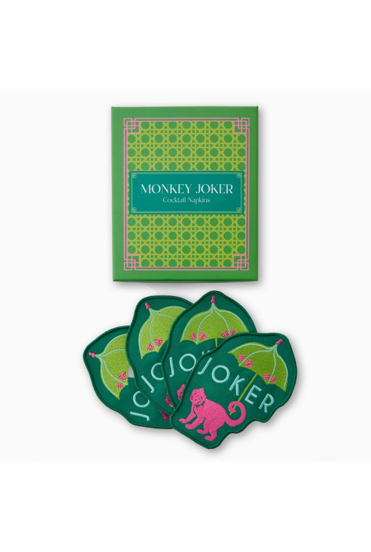 Green packaging of Monkey Joker cocktail napkins with a pink monkey design on a white background