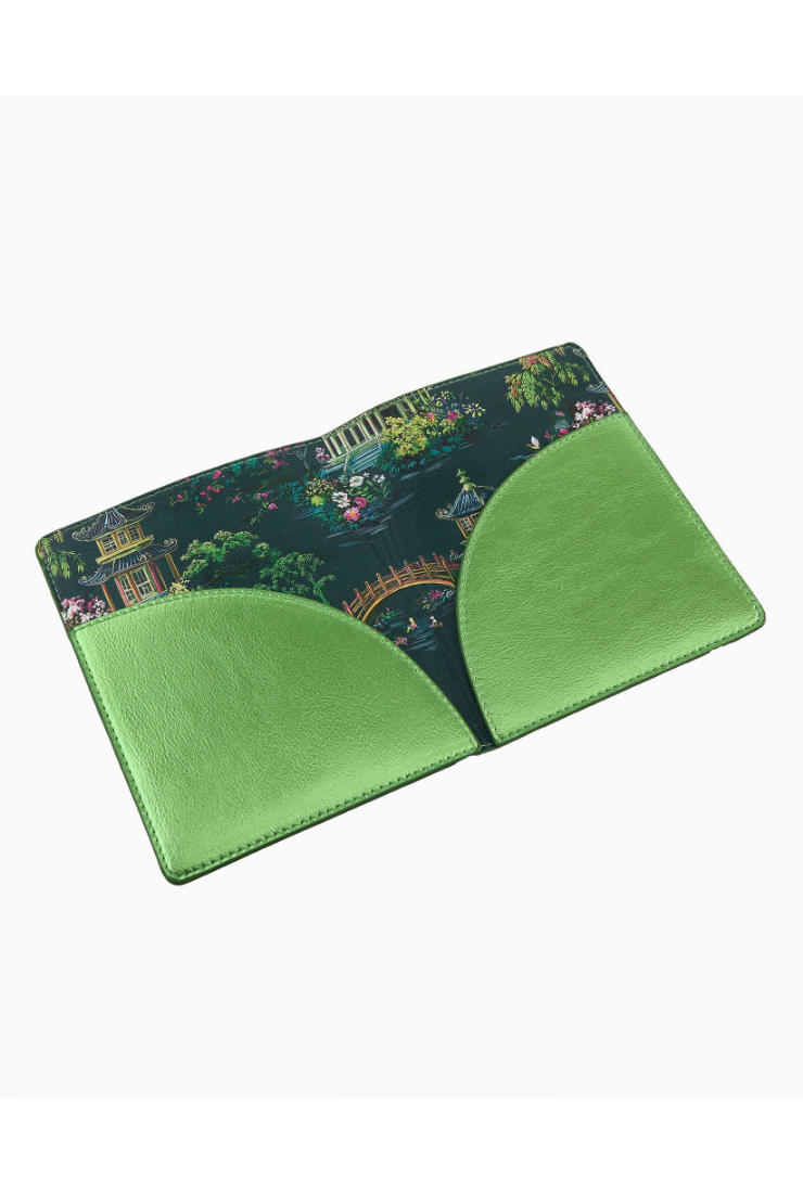 Green cardholder with patterned flap on a white background