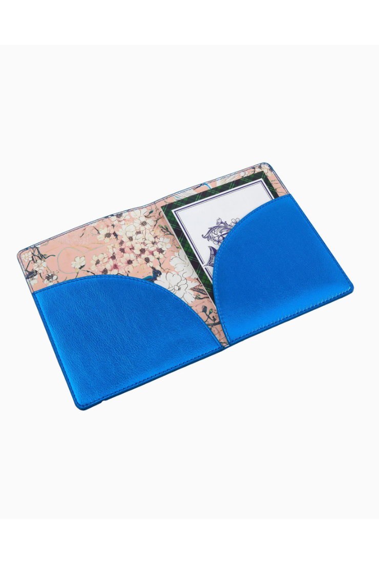 Blue cushion with floral pattern on a white background