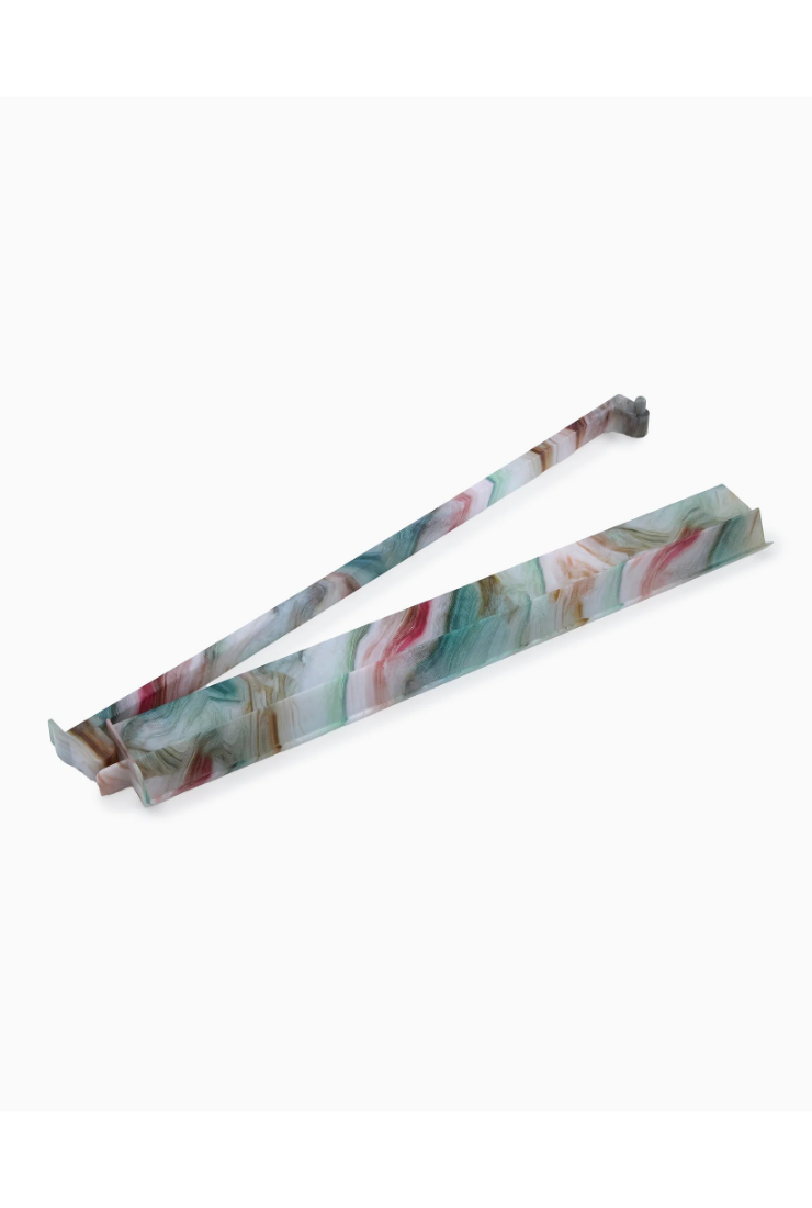 Floral-patterned tongs on a white background