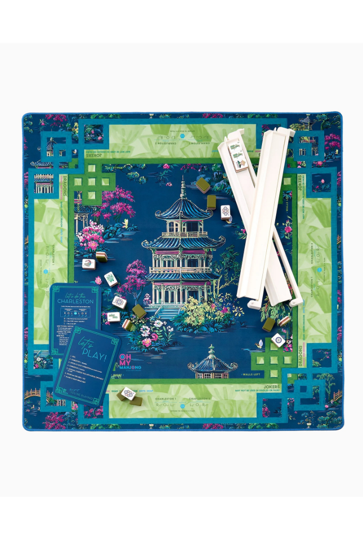 Board game set with a scenic board, dice, and rods on a white background