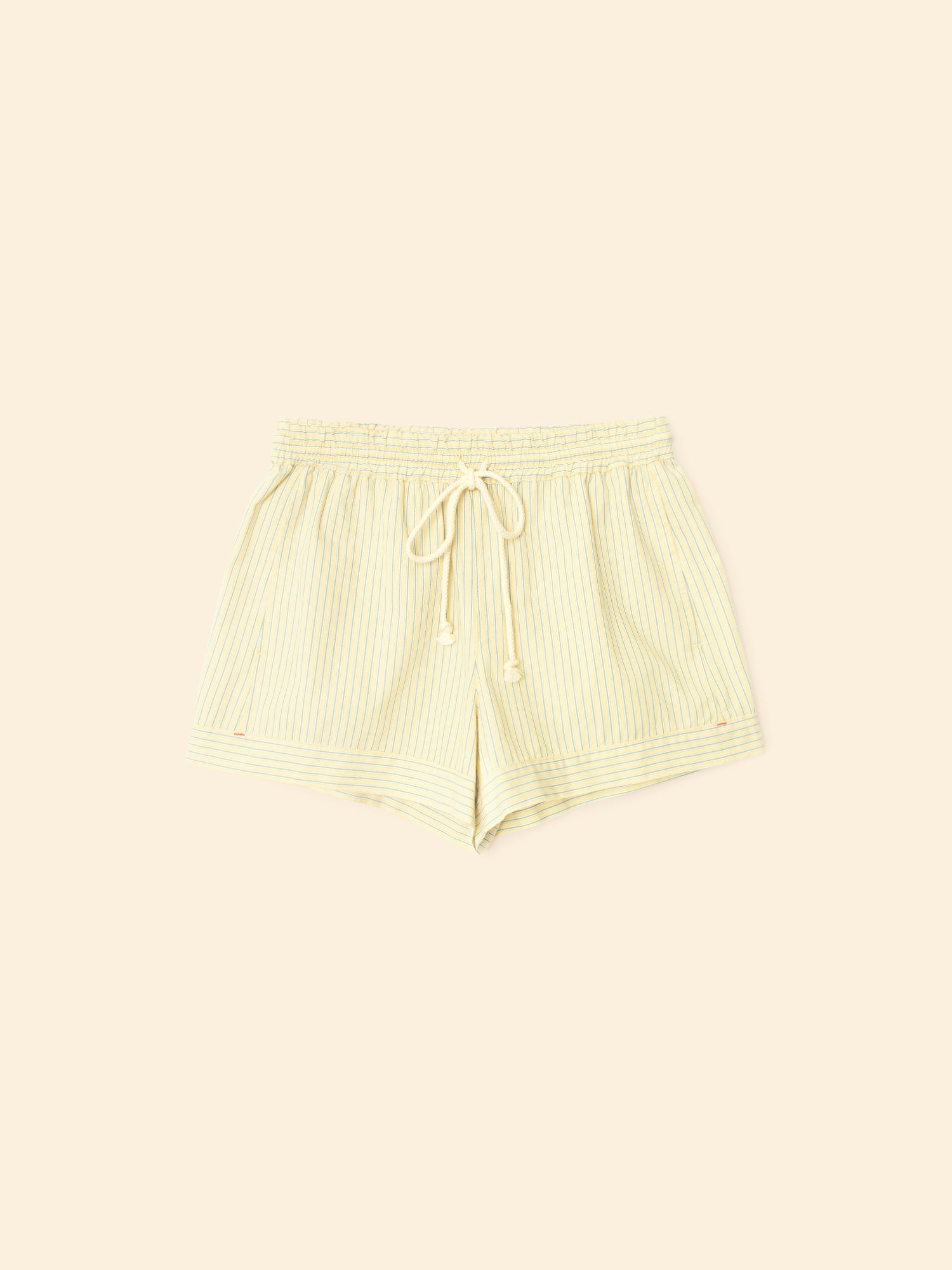 Light yellow ribbed shorts on a matching background
