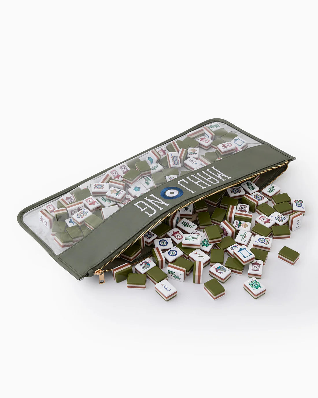 Mahjong set with tiles spilling out of a green carrying case on a white background