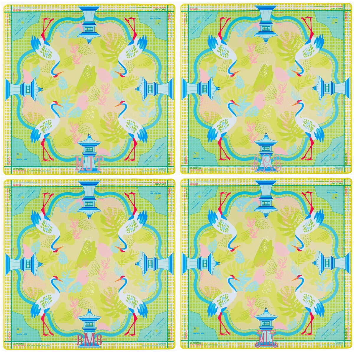 Four identical colorful placemats with a design of birds and a pagoda.