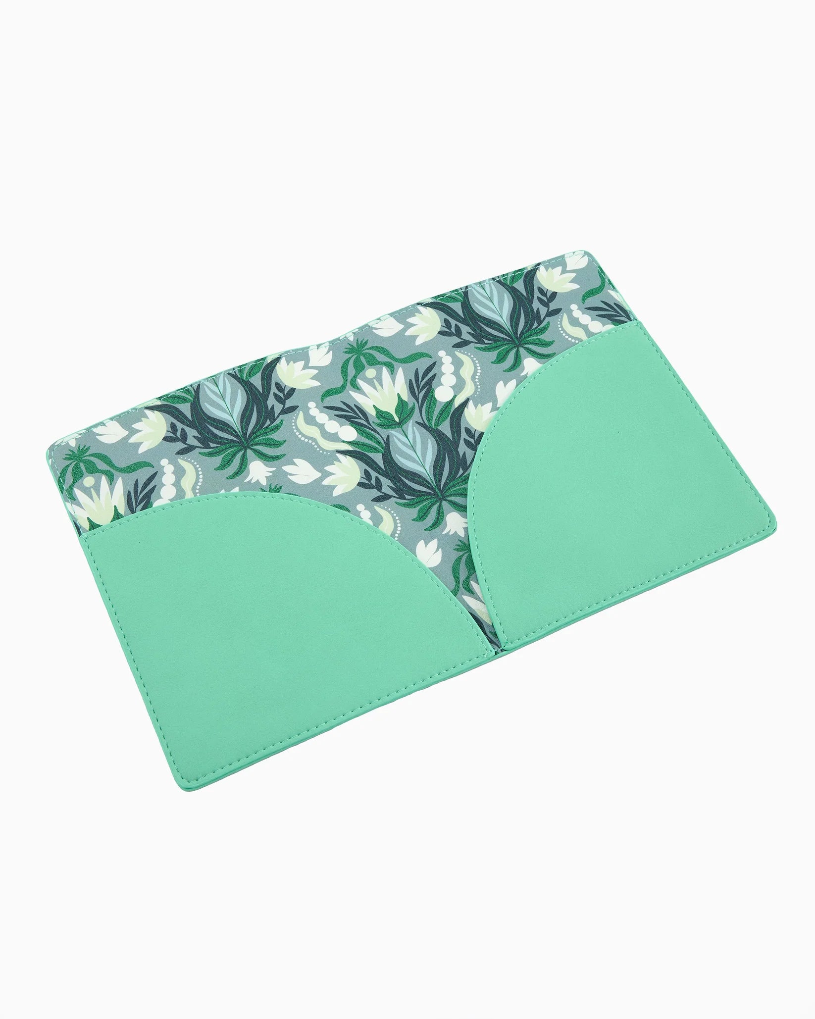 Green placemat with floral pattern on a white background