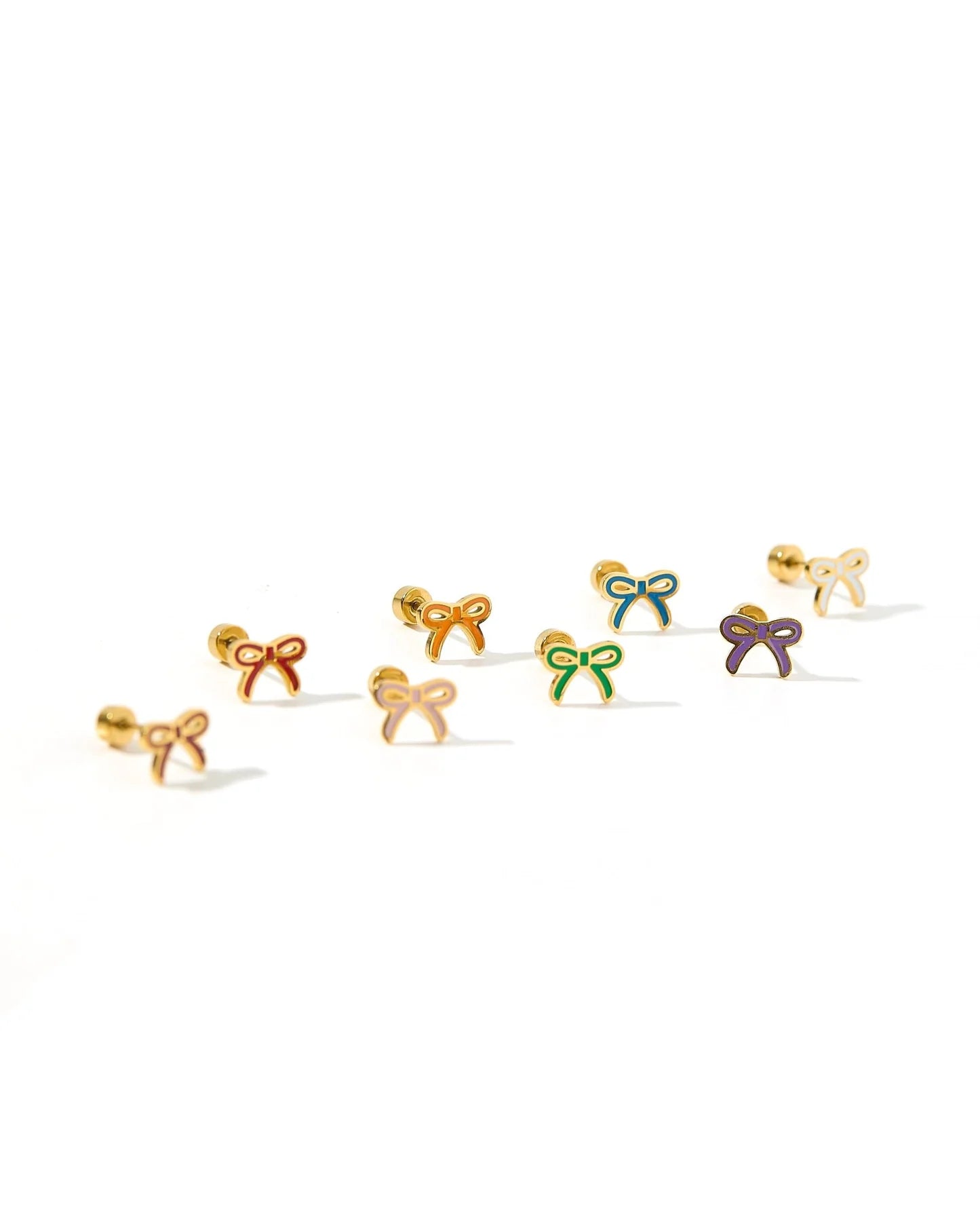 Gold bow-shaped earrings on a white background with colored centers.