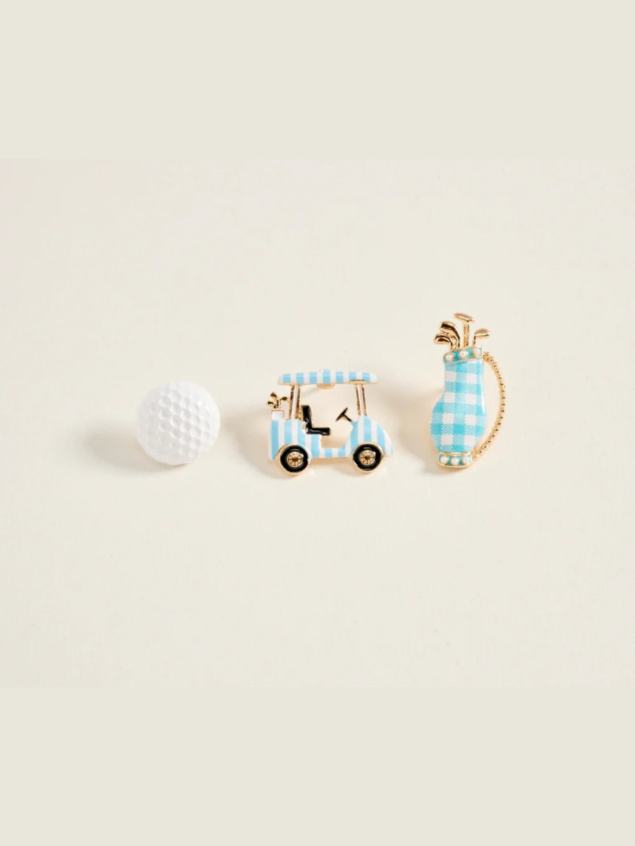Golf-themed earrings with a golf cart and golf club design on a light beige background.