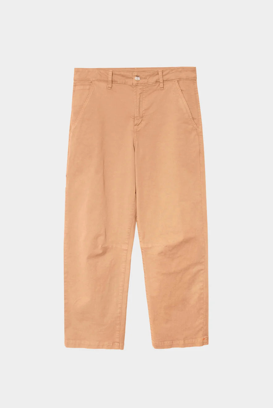 Tan pants on a light gray background