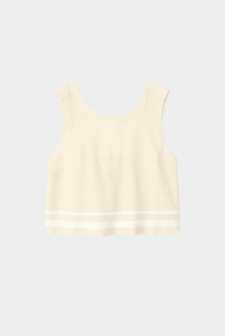 Cream-colored sleeveless top on a light gray background