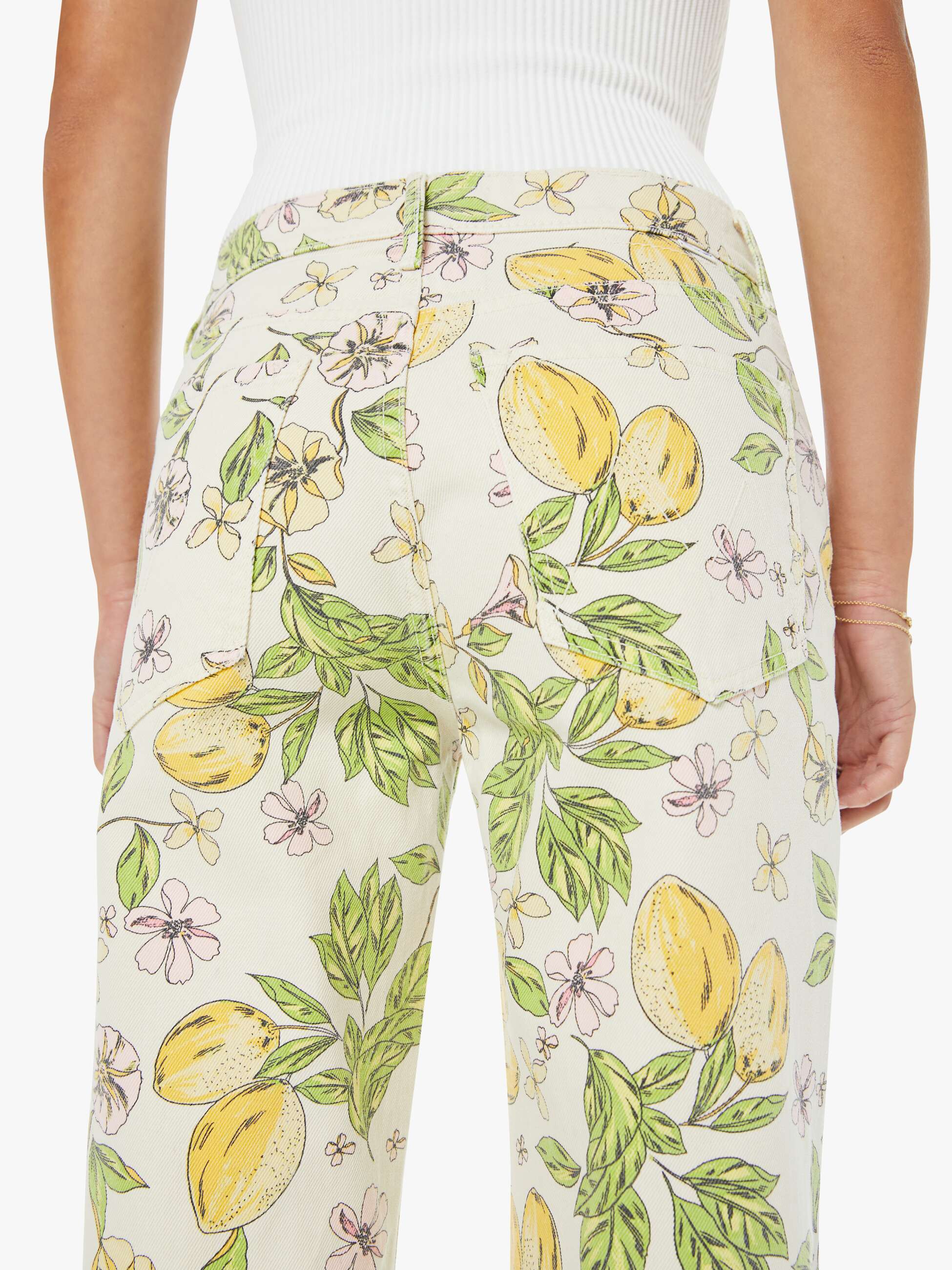 Floral and lemon patterned pants worn by a person