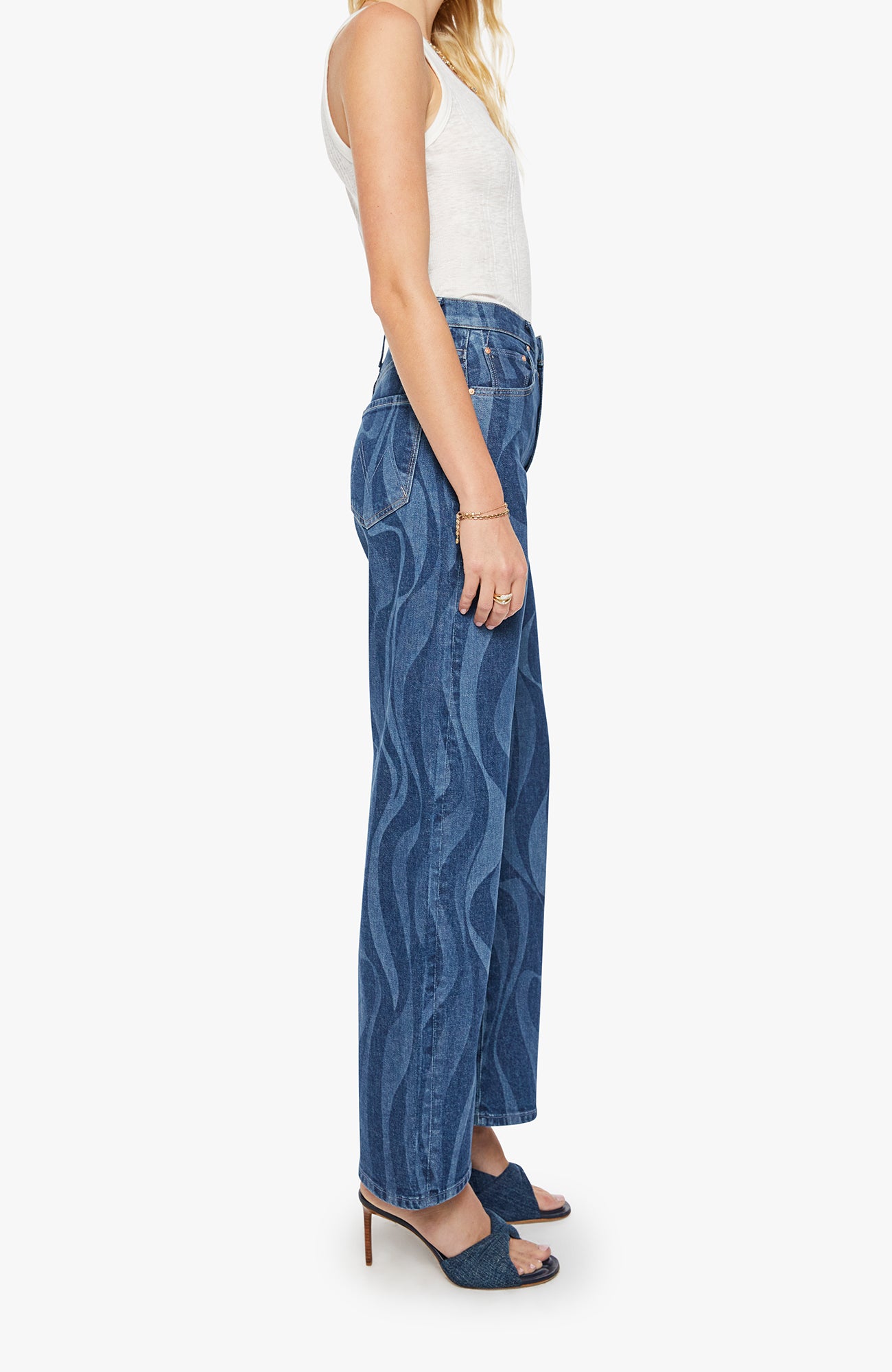Woman wearing blue patterned pants on a white background