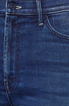 Close-up of blue denim fabric with stitching details