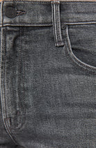 Close-up of gray jeans with stitching details