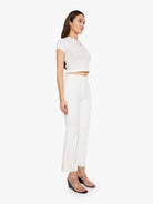 Woman wearing a white outfit on a white background