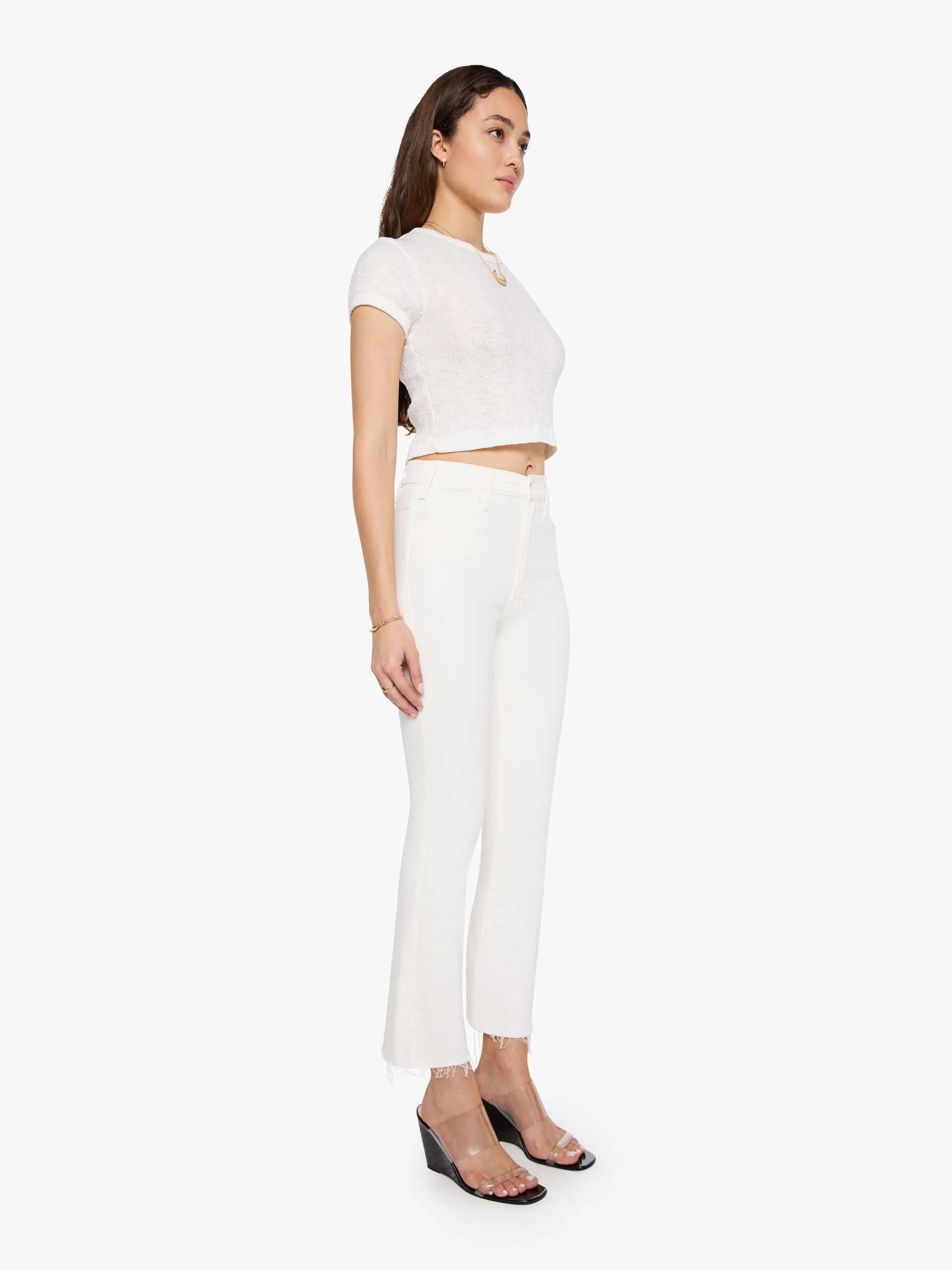 Woman wearing a white outfit on a white background