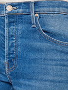 Close-up of blue denim jeans with stitching details