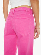 Person wearing bright pink pants on a white background