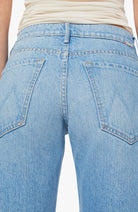 Light blue jeans with a white background