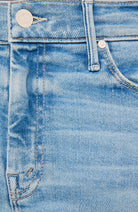 Close-up of light blue denim jeans showing the waistband, belt loops, button, stitching, and part of the front pocket.