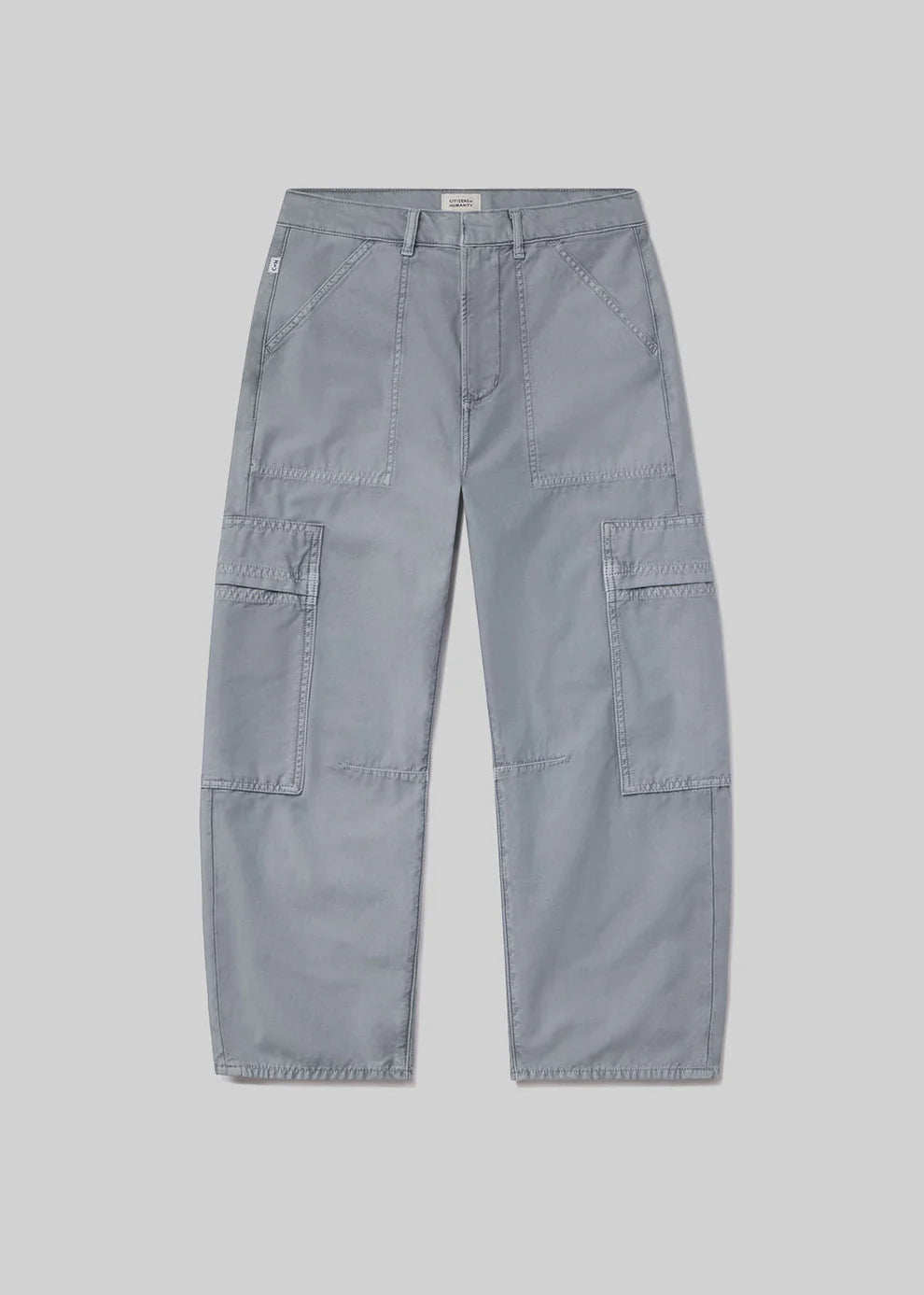 Light blue cargo pants on a gray background