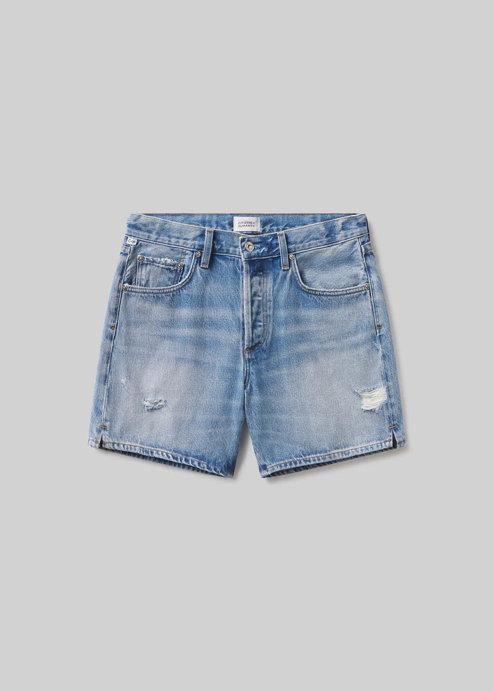 Blue denim shorts on a gray background