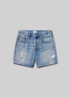 Blue denim shorts on a gray background