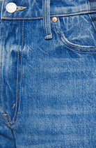 Close-up of blue denim fabric with stitching details