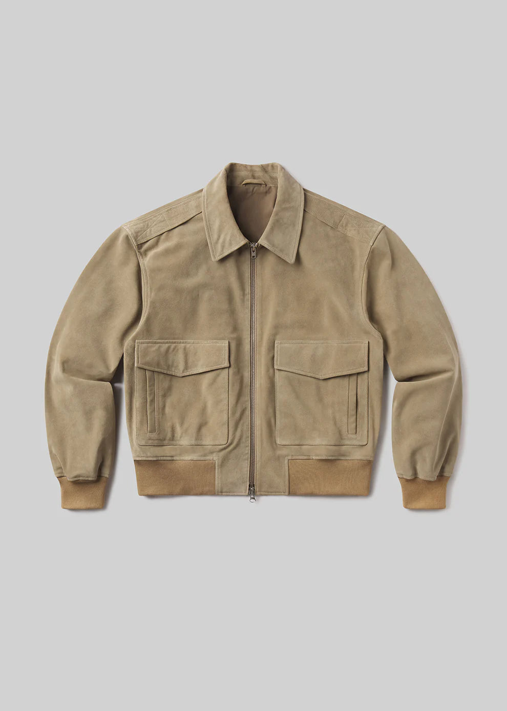 Beige jacket with two front pockets on a light gray background