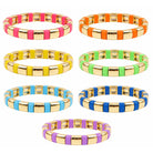 Set of colorful bracelets with gold bands on a white background